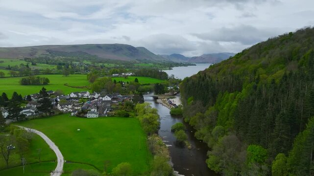 Farms over Ullswater Lake from a drone, Pooley Bridge, Lake District National Park, Cumbria, England, United Kingdom