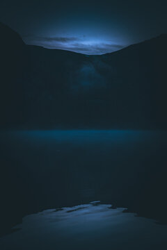 Dark blue mountain lake reflection in Cathedral Park