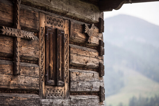 traditional wooden highland house detail with carved window in podhale