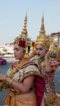 Thai Dancers in Traditional Costumes Preparing for Outdoor Performance