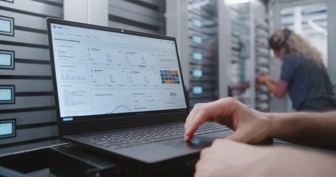 Male Network Engineer Manages Critical Overheating Event Through CLI, Reviewing Telemetry and Entering Recovery Commands While Monitoring Server Infrastructure During Urgent Technical Response.