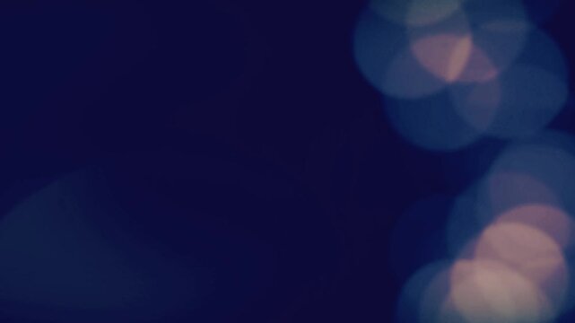 Animated white hand drawn circular sunburst elements against a dark blue blurred light background with sunburst circles animating doodle style sunburst background soft bokeh video white decoration