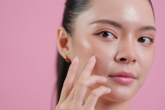 Asian woman touching smooth face for beauty and skincare routine concept