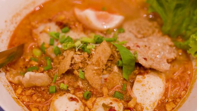 Spicy Tom Yum Noodle Soup with Boiled Egg and Fish Balls