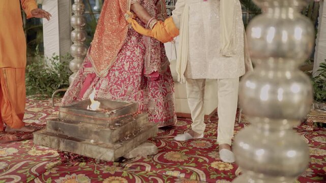 Saptapadi and Pheras Ceremony in Indian Hindu Wedding, Bride and Groom Walking Around Havan Kund