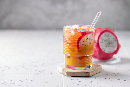 Refreshing Dragon Fruit and Mango Cocktail in glass on the table