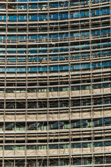 Modern high-rise building covered in scaffolding © StockMediaSeller