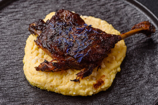 Duck leg confit roasted with salt and allspice. Duck leg confit