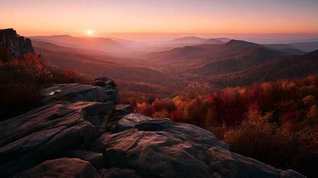 Breathtaking autumn sunrise over majestic mountain range with vibrant fall foliage and rocky cliffs