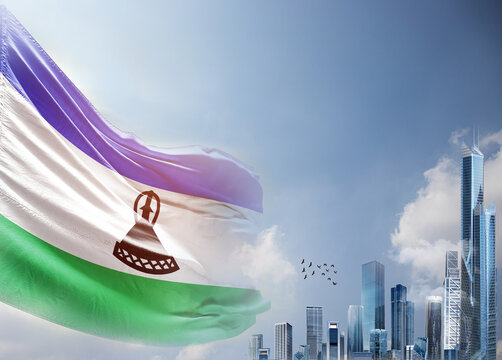 Lesotho national flag waving in sky with modern building skyline. Lesotho national flag for independence day.