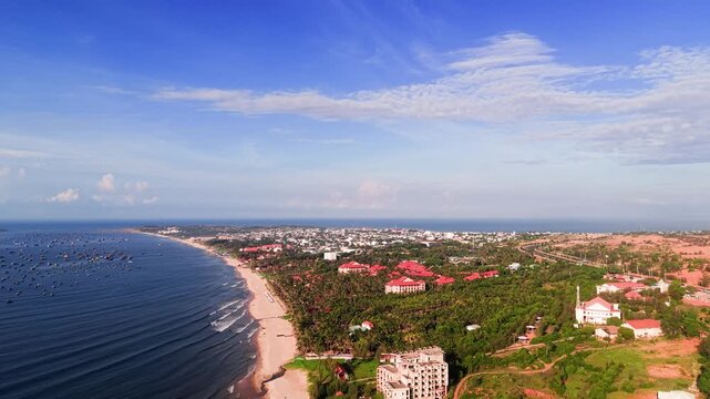 The beautiful coastline of Xuan Thuy in Mui Ne, Lam Dong. The camera captures the beach, water, and surrounding area during a bright day.