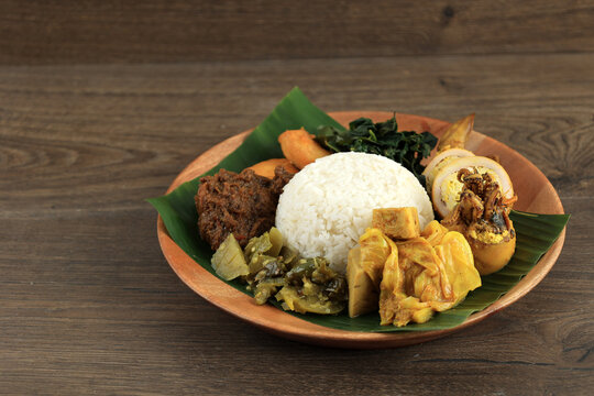 Nasi Padang or Nasi Kapau with Rendang, Sambal Ijo, Talua Barendo, and Squid Curry