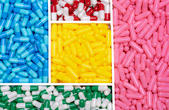 Capsule pills in plastic tray. Vitamins and supplements concept. Antibiotic drug selection. Pills capsule manufacturing. Drug use in dermatology clinic. Supplements industry. Pharmaceutical industry.