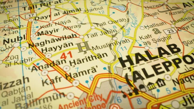 Syria road network leading toward Aleppo &ndash; gliding view over an atlas map
