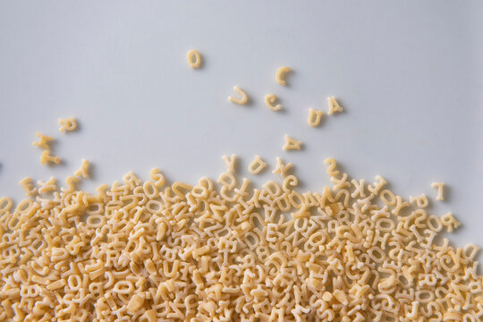 Alphabet pasta letters creating learning and communication concept