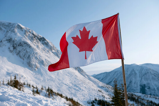 Snowy mountain peaks rise beneath a clear blue sky. Canadian flag waves boldly in the crisp winter air. Red and white colors stand out against the frosty landscape