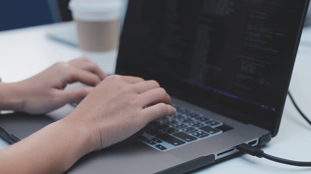 Asian happy woman and man programmer team coding software at computer in dark tech office, Concept of digital transformation, modern cyber security, startup teamwork and future IT digital network