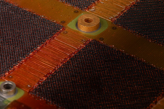 Antique magnetic core memory module with copper wiring and ferrite cores, vintage computer technology