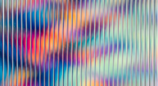 Abstract holographic fluted glass texture with iridescent rainbow light refraction