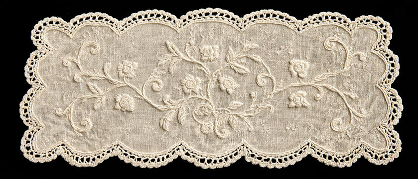 Intricate Lace Floral Pattern: A delicate, off-white lace creation features a flowing floral design with roses and leaves, bordered by a scalloped edge, showcasing fine craftsmanship.