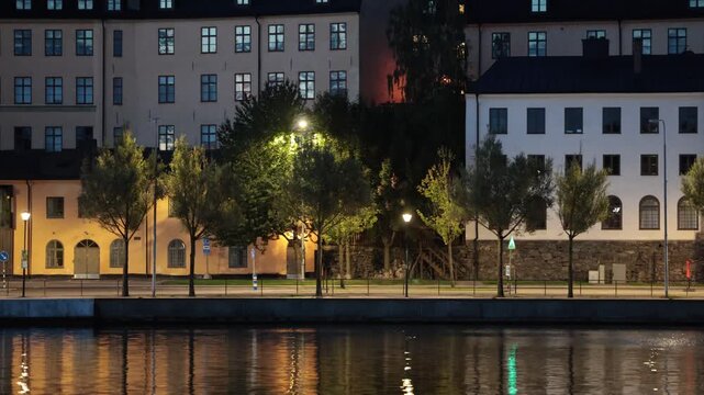 Stockholm, Sweden A night view of Soder Malarstrand street and old building facades and reflections in the Sodermalm district. 
