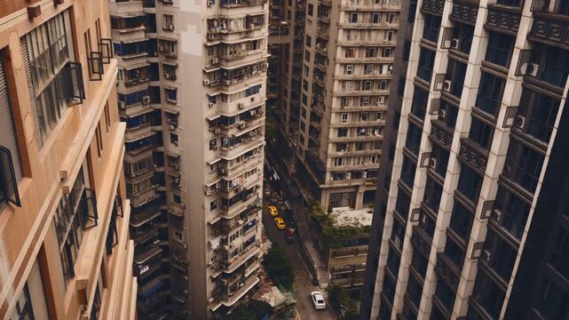 Life in China, tall condominium in downtown, overpopulation and concrete jungle. Modern architecture in center of city Chengdu, hotels and living houses in residential area, real estate, apartments