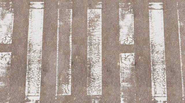 Urban infrastructure concept, top view of weathered zebra crossing and tactile paving sideroad. 3d animation.