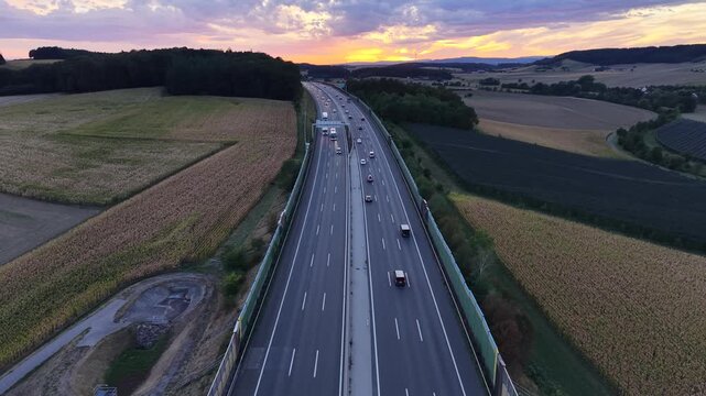 Aerial or ground-level footage showing traffic moving along a major Austrian highway surrounded by open landscape. 