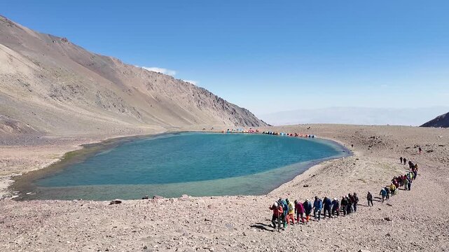 Hikers Trekking Around a High Altitude Mountain Lake in Bamyan