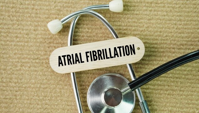 Stethoscope and stick with words Atrial fibrillation is an irregular and often very fast heart rhythm where the upper chambers of the heart beat chaotically out of sync with the lower chambers