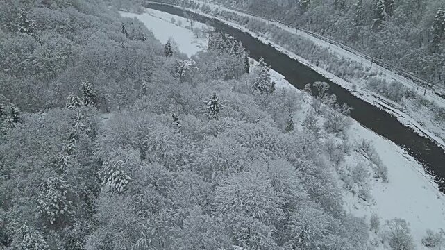 Aerial view of the Poprad River in Beskid Sadecki on a snowy ,winter day