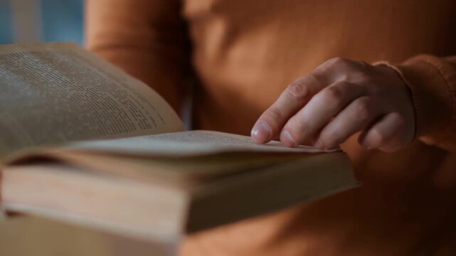 close up hand old man reading book textbook hobby home library male grandfather mature ready reader pensioner senior novel professor literature glasses health interest business office inside. learn