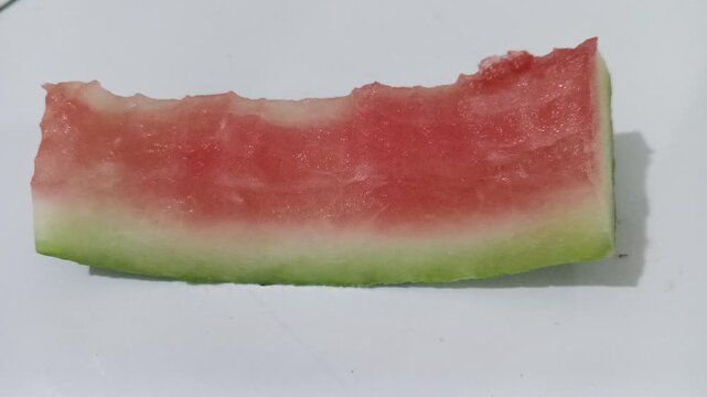 Bitten slice of fresh red watermelon
