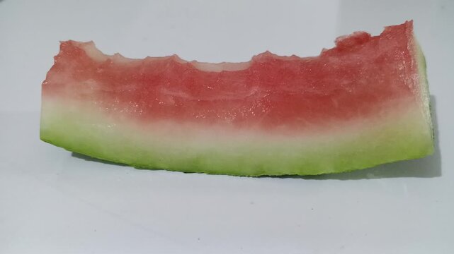 Bitten slice of fresh red watermelon

