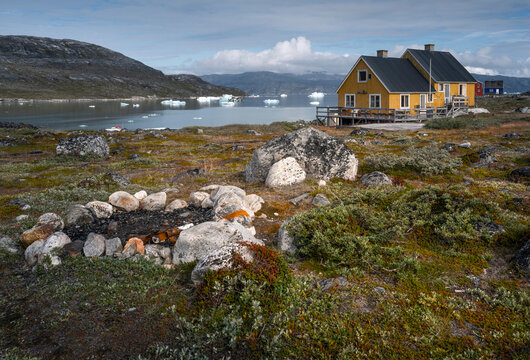 Qoornoq village with floating icebergs in Nuuk fjords, Greenland