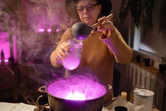 realistic witch witchcrafting brewing potion in cauldron. Everyday life intertwined with traditional witchcraft, magic and mystical atmosphere.