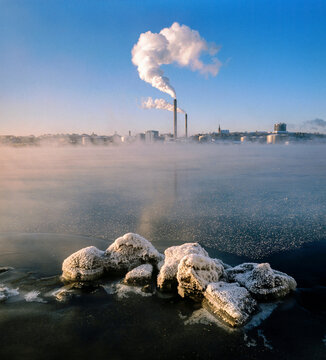 Power plant with smoke stack on coastline