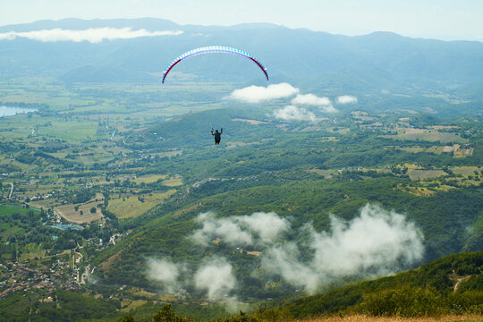 paraglider over the green mountains