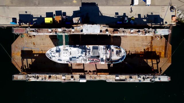 Ship getting an overhaul at drydock of Tromso Mekaniske AS. Overhead drone riser