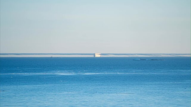 Timelapse of a Fata Morgana mirage on the horizon of the sunny Gulf of Finland