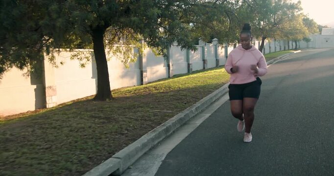 Lifestyle videos outdoor of people doing activities, running outdoors, woman jogging on suburban str