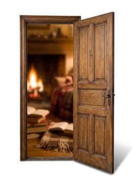 Open wooden door revealing a cozy, warm living room with a fireplace, open books, and a plaid blanket in a rustic interior.