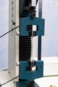 Tensile Strength Test of Material Sample in Laboratory Testing Machine
