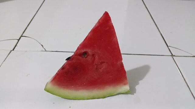 Fresh triangle slice of red watermelon