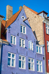 Fototapeta premium Close-up of the colorful facades of typical buildings on Nyhavn Street in Copenhagen, Denmark.