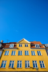 Fototapeta premium Close-up of the colorful facades of typical buildings on Nyhavn Street in Copenhagen, Denmark.