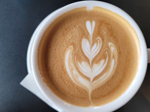"Latte Art Flower Pattern from Above" "Top View of Coffee with Latte Art"  "Rosetta Latte Art in White Cup"
