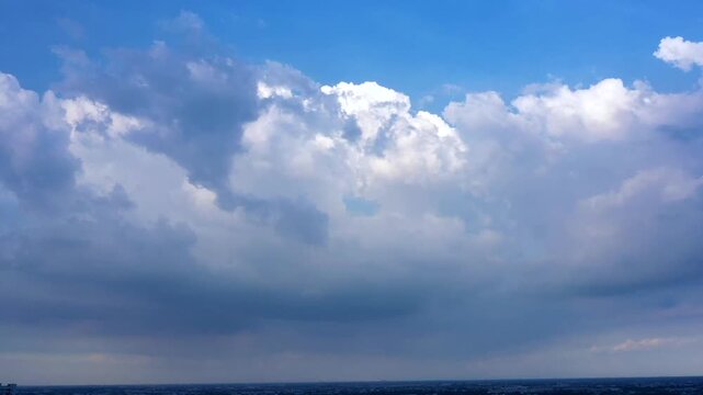 Beautiful clear blue sky with white clouds background. rolling puffy cloud movie. high beautiful cloud space weather beautiful blue sky glow clouds background. Timelapse. 