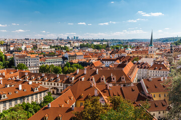 Obraz premium Prague Cityscape Over Historic Red Rooftops in the Czech Republic