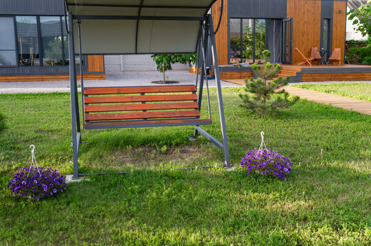 Garden swing, gazebo near the house for relaxing on the lawn. Sided house and country getaway; rentals available.